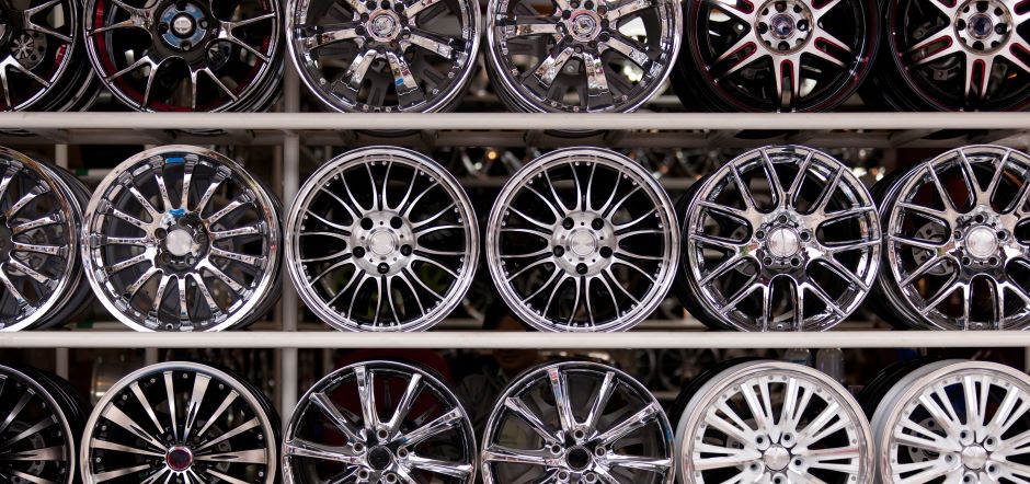 vehicle wheels from different brands on display rack